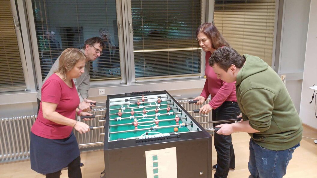 QFS team playing foosball